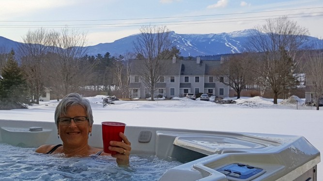 enjoying the hot tub looking out on Mt. Mansfield